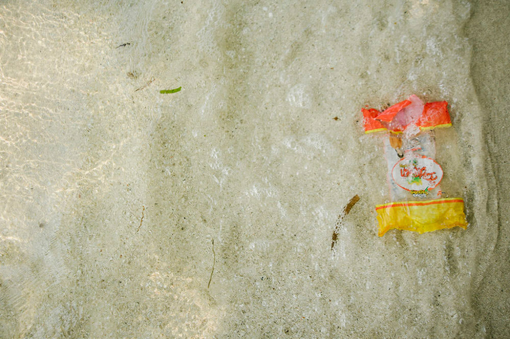 JAKARTA, INDONESIA - SEPTEMBER 03 : A plastic packaging as the ocean approaches to drift it out to sea, on Thousand Islands, Jakarta, in Indonesia, 03 September 2016.