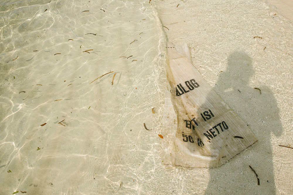 JAKARTA, INDONESIA - SEPTEMBER 03 : A sack made of plastic the sand as the ocean approaches to drift it out to sea, on Thousand Islands, Jakarta, in Indonesia, 03 September 2016.