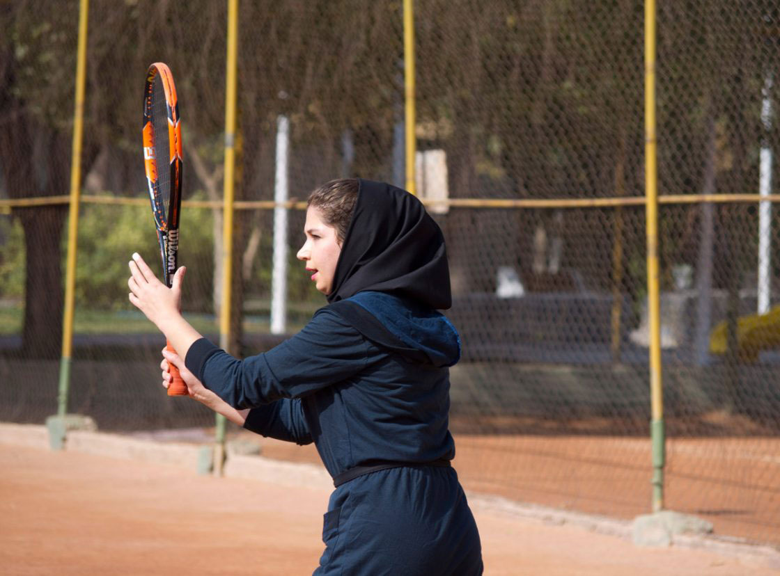 Tehran, Iran - November 2016. A girl is playing tennis.